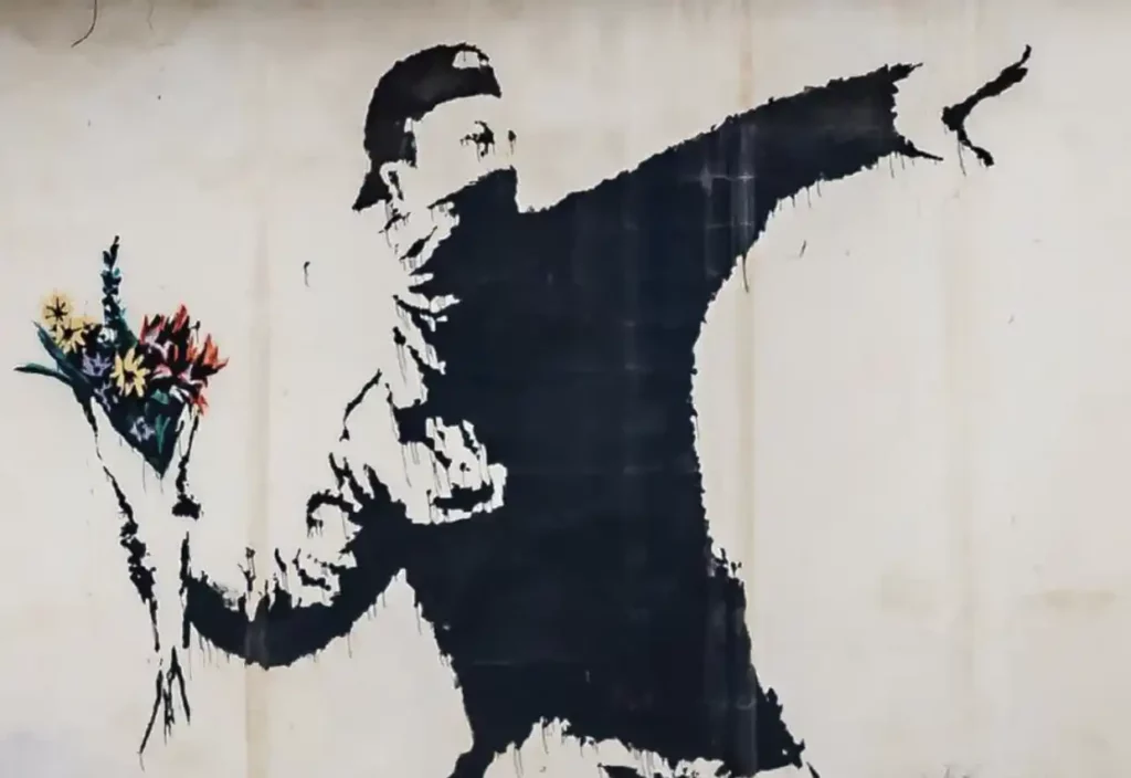 Banksy L'homme jette des fleurs